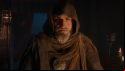 The adviser from Total War: Warhammer, an old man in a brown hooded cloak, wearing several leather wraps and a golden medallion