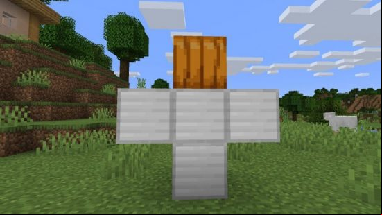 How to make a Minecraft iron golem: four iron blocks in a t-shape with a pumpkin on top, to display where a carved pumpkin or jack o'lantern should be placed