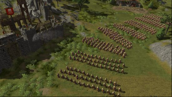 Games like Total War: A battalion of soldiers split into platoons standing ready beside a stone castle in Hegemony III - Clash of the Ancients.