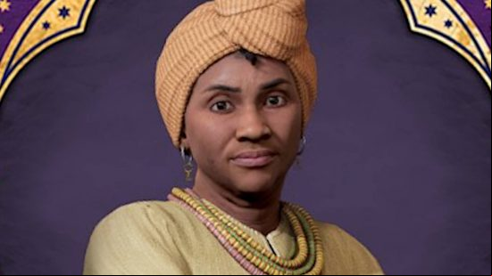 Hogwarts Legacy characters - Professor Onai is wearing an orange headdress and bead necklaces.