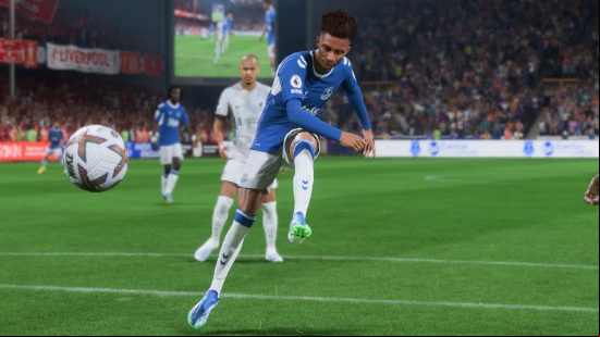 How to do a FIFA 23 power shot: a football player dressed in blue takes a powerful shot on goal