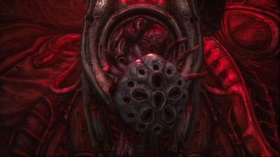 How to heal in Scorn: The healing tool in Scorn, a bulbous flesh sac with numerous tentacles protruding from it.