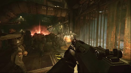 Best Darktide Veteran build - a Veteran with an autogun shooting at a horde of Scabs inside a factory. A pipe looms overhead with the numbers 132-256 written on it.