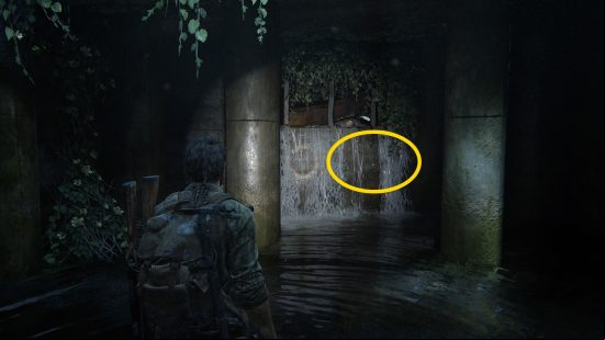 The Last of Us Firefly Pendants locations: a man, knee-deep in water, shines his flashlight in a dark room.