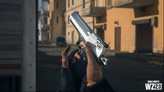 A huge silver handcannon glistens in the sun.