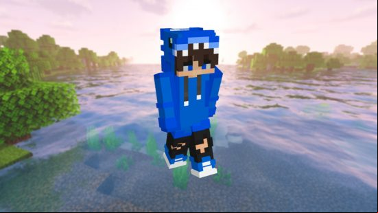 Best Minecraft skins: A Minecraft player stands int he snow in a blue hoodie skin, with the hood up.