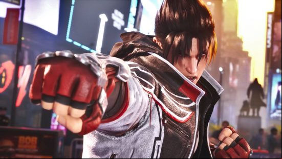 Tekken 8 tier list: Jin Kazama is wearing a white and black bomber jacket with a black hoodie and red gloves. He is standing in the middle of Times Square.