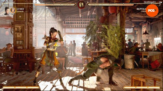 Mortal Kombat 1 review: Reptile is trying to sweep Li Mei who is blocking. The two are fighting inside a restaurant. This screenshot is of the online mode.