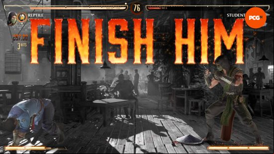 Kung Lao has been knocked off his feet by Reptile, who's just been instructed by big lettered shouty words to "Finish Him" by executing a MK1 fatality.