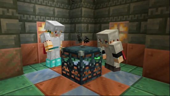 Two Minecraft players look at a new trial spawner, found inside Minecraft trial chambers.