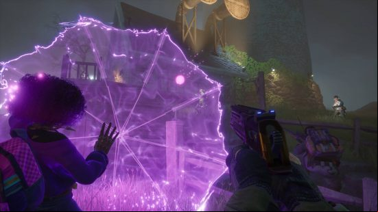A black woman uses purple energy to conjure an umbrella as another player stands behind her with a gun at the ready