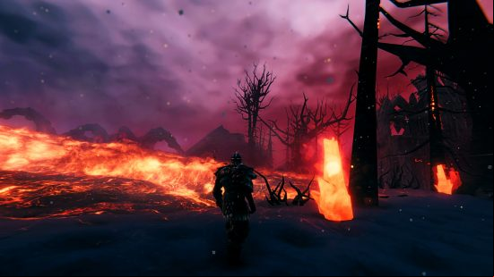 Valheim Ashlands update - A person crosses a blackened land, walking past a lake of lava.