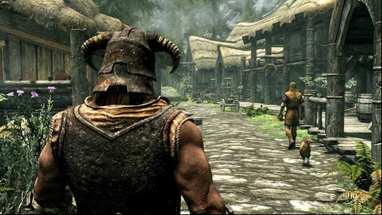 A player character in third-person looks at an NPC in the distance, walking through a village in The Elder Scrolls V Skyrim, one of the best games like Starfield.