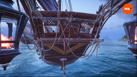 A close up of the stern of a Skull and Bones ship.
