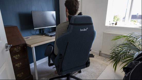 A tall man sat in the Boulies Master chair