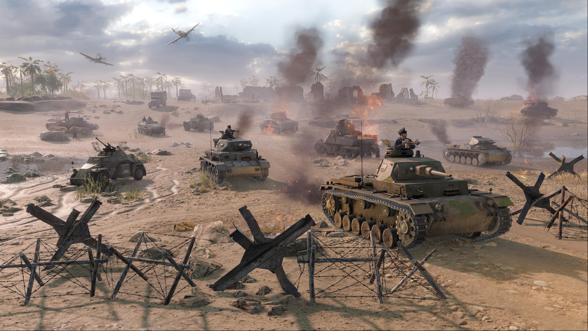 Several tanks push across the battlefield in men of war 2