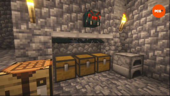 The entrance to a cave spider XP farm, showing chests and a swarm of spiders in one of the best Minecraft build ideas.