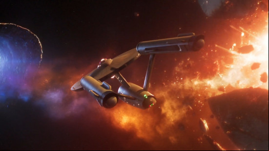 Best laptop games: Star Trek Fleet Command. Image shows the USS Enterprise flying near an exploding planet.
