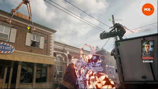 A teammate uses the Thrustodyne Wonder Weapon to suck an item out of a first floor window in the Black Ops 6 Zombies Liberty Falls main quest.