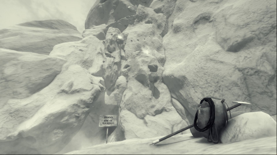 A snowy area of a mountain with a backpack in front.