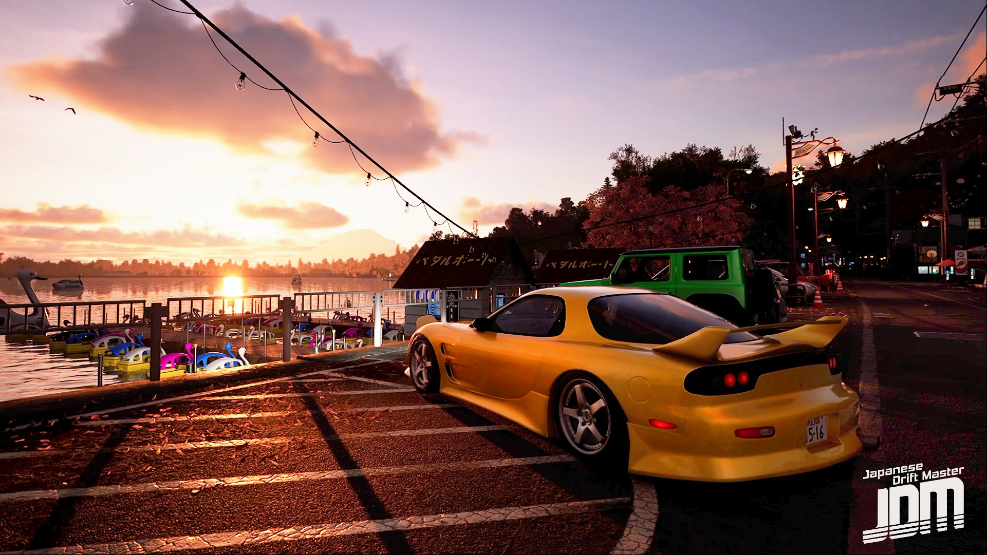 JDM: A yellow car with a body kit parked in front of a lake at sunset