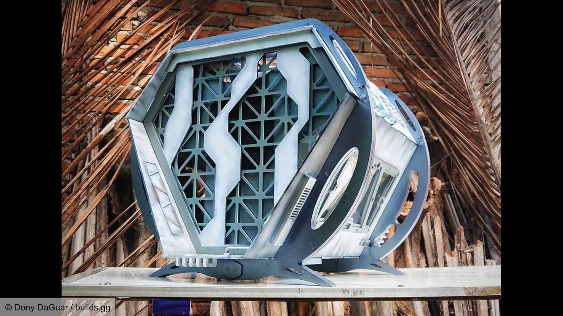Futuristic space-like gaming PC build, side and front view