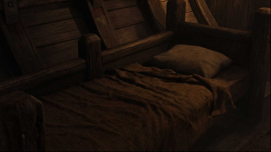 A bed in a dark room in Oblivion Remastered.