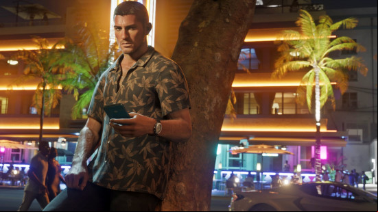 GTA 6 release date: Jason reclines against a palm tree as he surveys Vice City's nightlife while holding his phone.